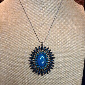 Sterling Silver chair with stone Blue pendant. Turquoise surrounding